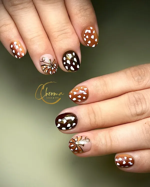 Chocolate brown nails with deer-print spots