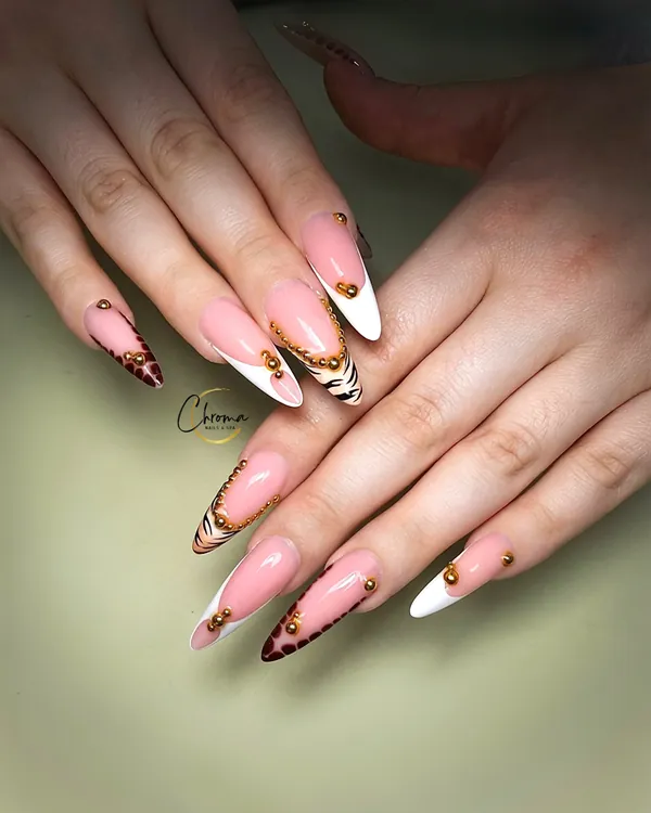 Pink nude nails with animal print tips and gold lines