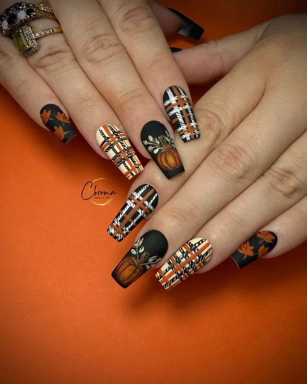 Burnt orange and black nails with tartan details