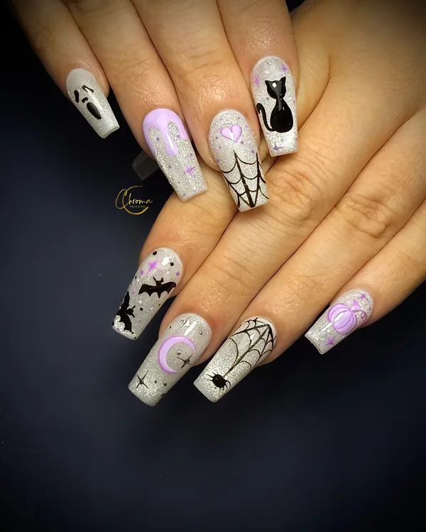 Long shimmering nails with lilac moons, black cats, bats, ghosts and spider webs