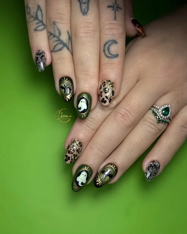 Almond nails with ghosts in gold frames, leopard print, skeleton hands and deep green